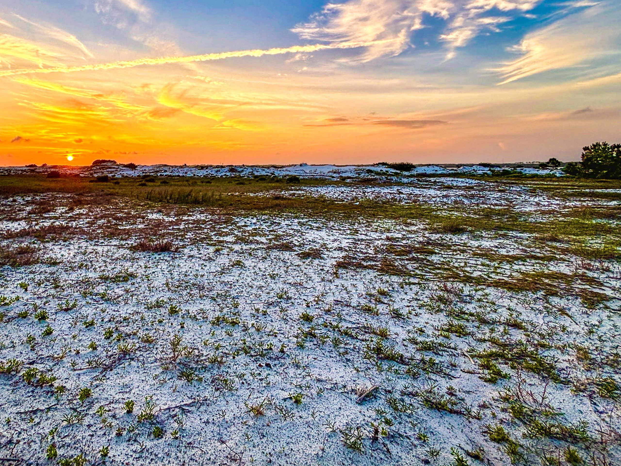 Florida beach at sunset with wide sandy shoreline
