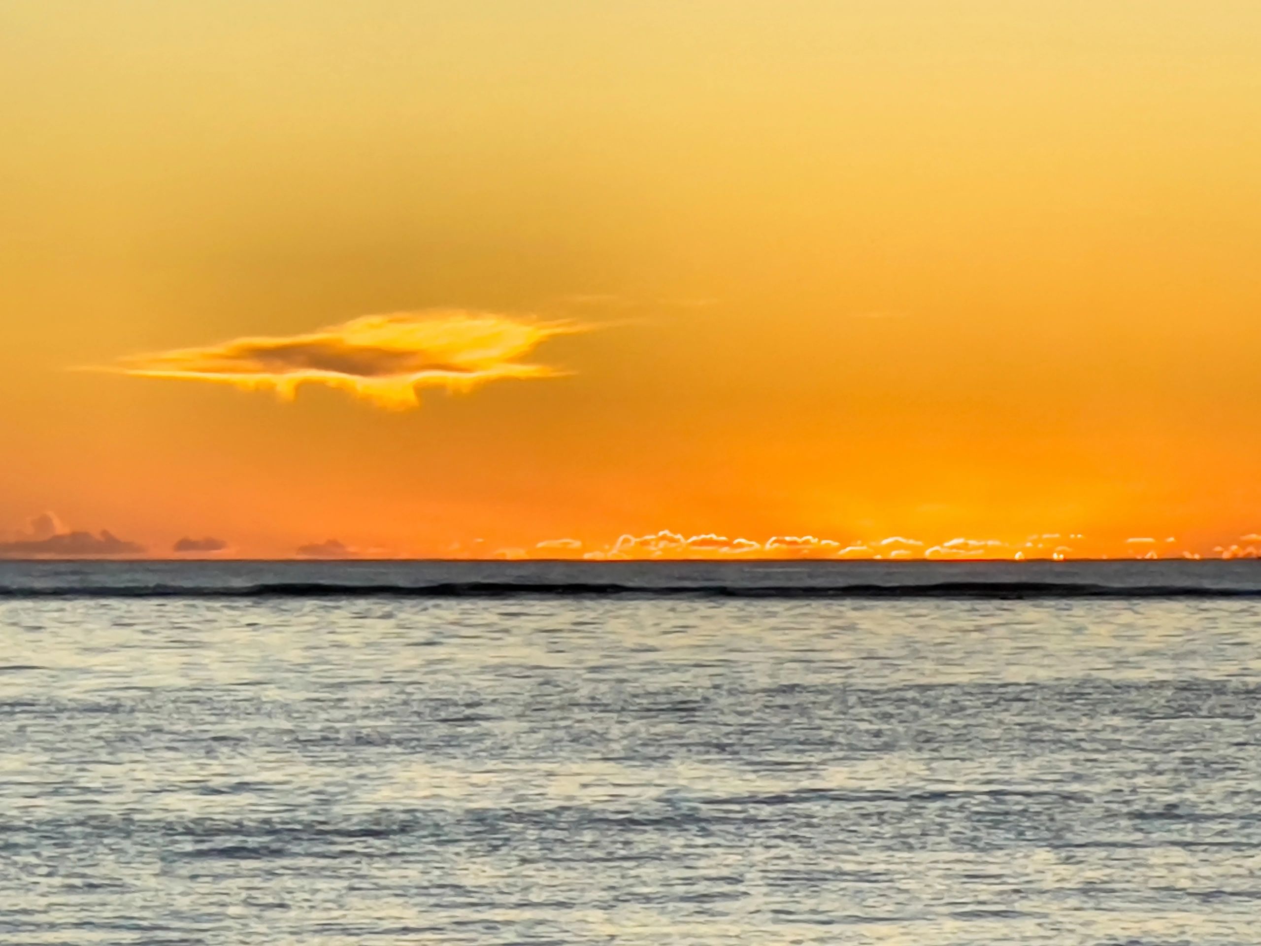 Sunset colors over a Gulf beach shoreline